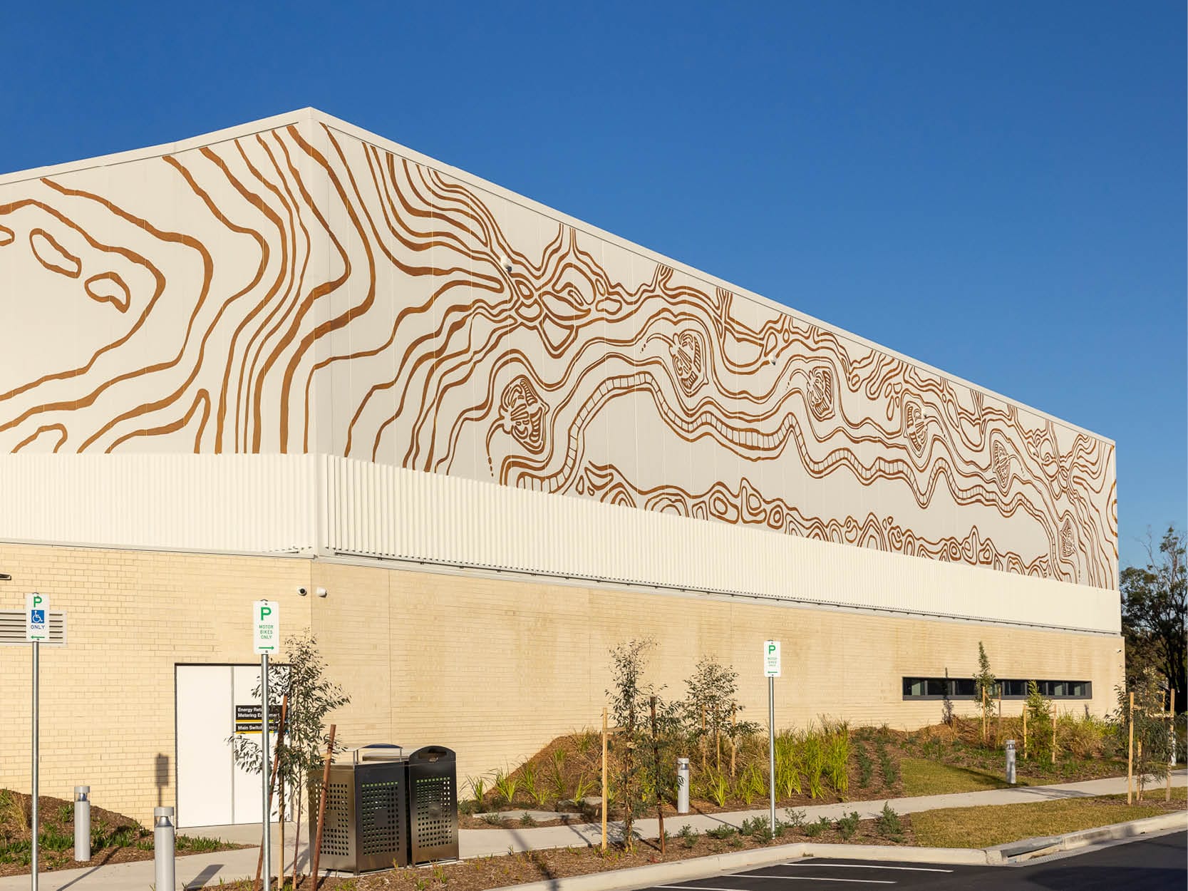 Heffron Centre Golden Motif Facade by Tilt