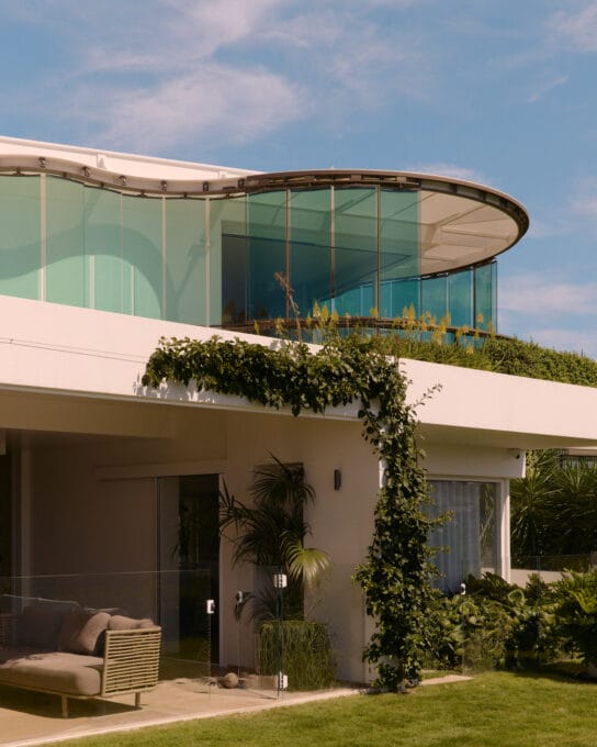 Glass louvre facade on residential beachside home by Luigi Rosselli Architects and Tilt Industrial Design