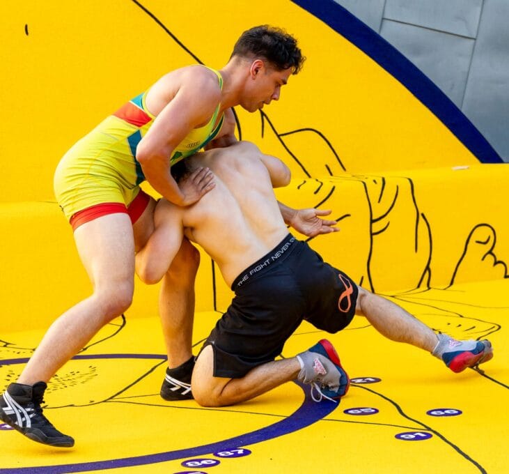 Bread, Circuses and Home. Thakral and Tagra. Performance Art. Fed Square. Melbourne. Custom wrestling mat. Tilt Industrial Design.