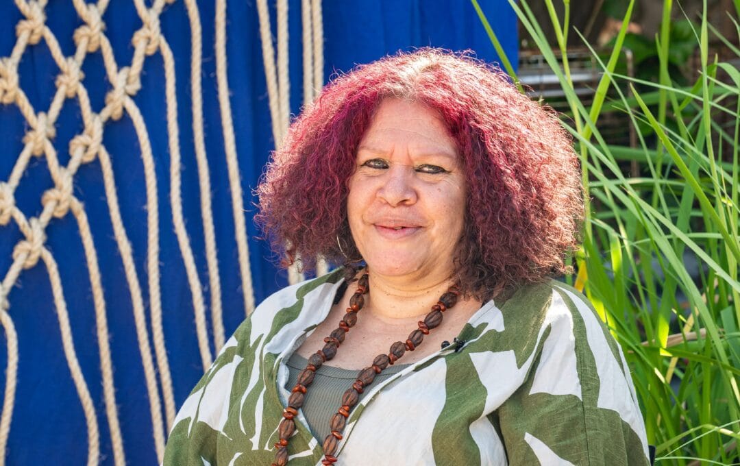 Nadeena Dixon with her artwork, 'Birrang Narrami (Star Net)', for Sydney Fish Market